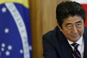 Japan's Prime Minister Shinzo Abe looks on during a meeting with Brazil's President Dilma Rousseff in Brasilia